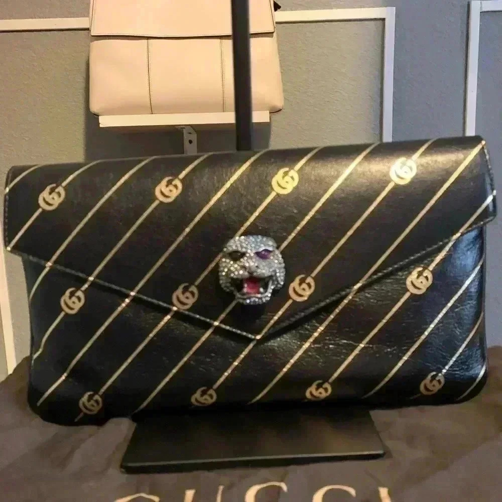 Gucci Double GG Broadway clutch.